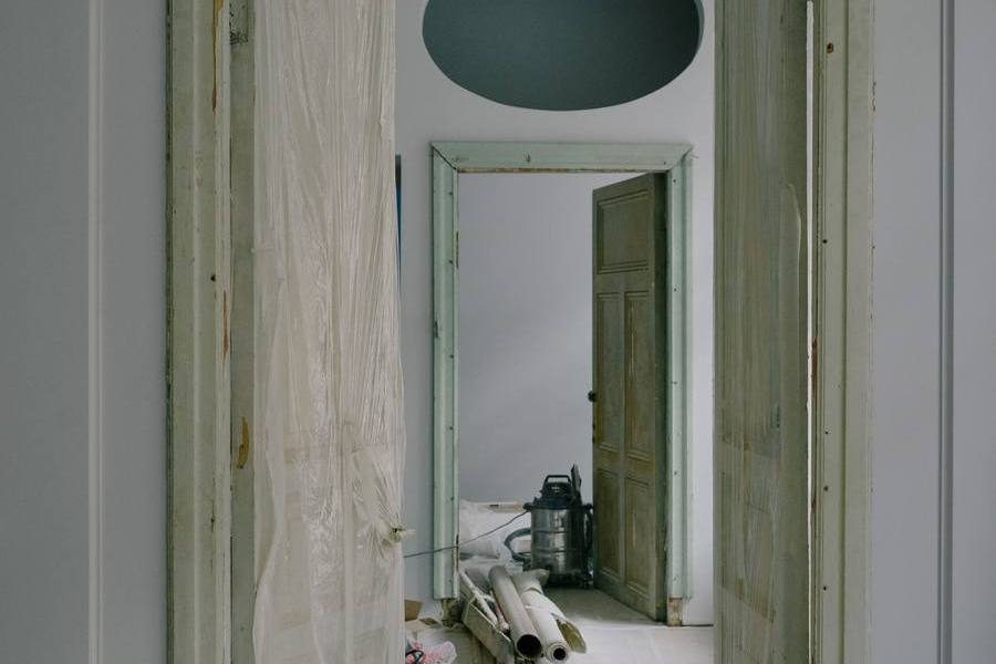 Plastic sheeting set up over a doorway to contain a work area during remediation